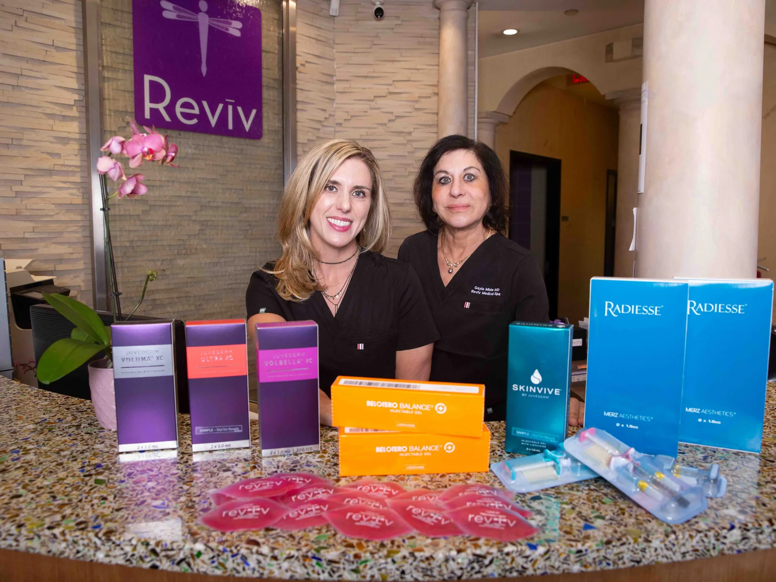 Reviv Med Spa team with the dermal filler collection — Juvéderm, Radiesse, Belotero, and Skinvive — in Millbrae